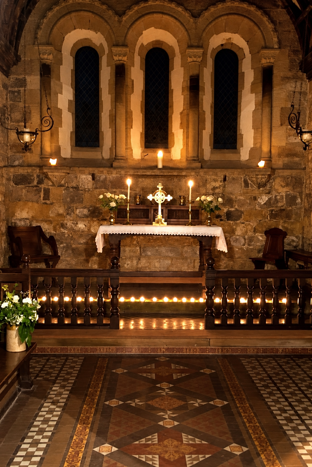 Church altar glowing by candlelight