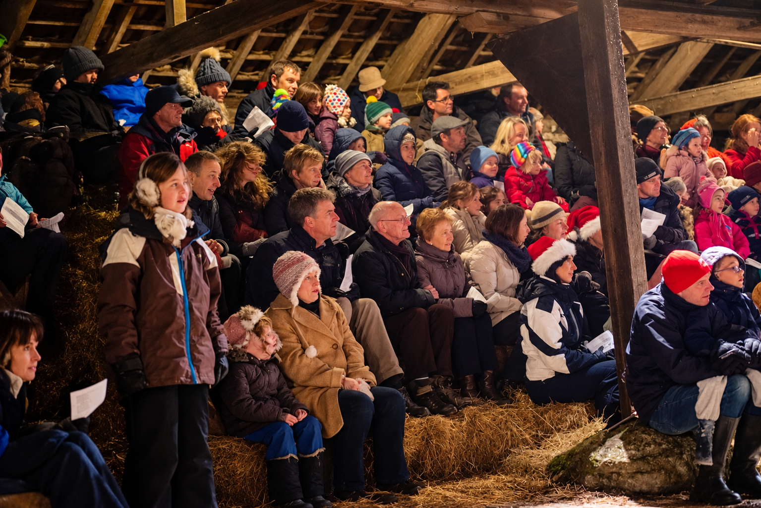 Families gathered in the stable yard to watch the live nativity
